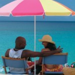 usvi_couple_under_umbrella_beach